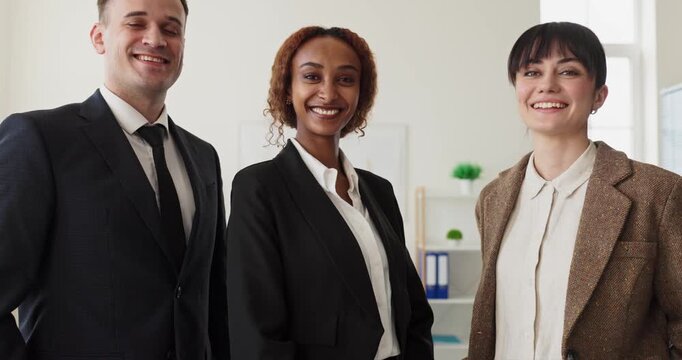 Business team portrait of coworkers in office. Confident professionals and leaders smile in a bright workspace, ready for a meeting and collaboration. Clear concept of teamwork and success.