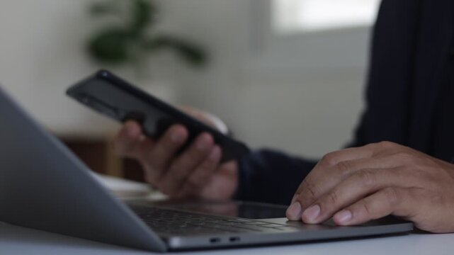 MFA Cyber security protection concept. Businessman working on a laptop to login password multi factor authentication, verification code on smartphone for identity identification for online banking.