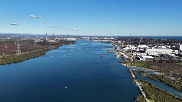 Osborne, Adelaide, South Australia &ndash; 4K aerial drone footage of Port Adelaide River, Torrens Island, industrial waterfront, ASC Shipyard, maritime facilities and coastal wetlands.