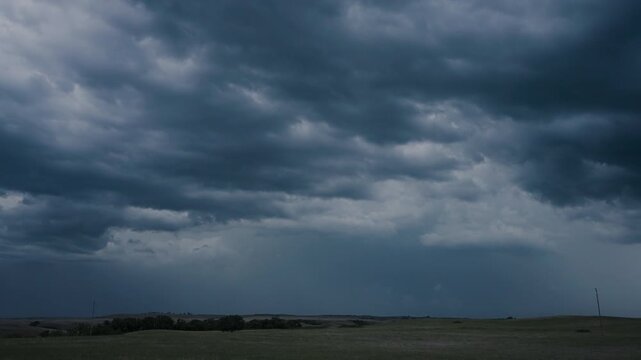Blackened thunderclouds erupting with bright lightning flashes