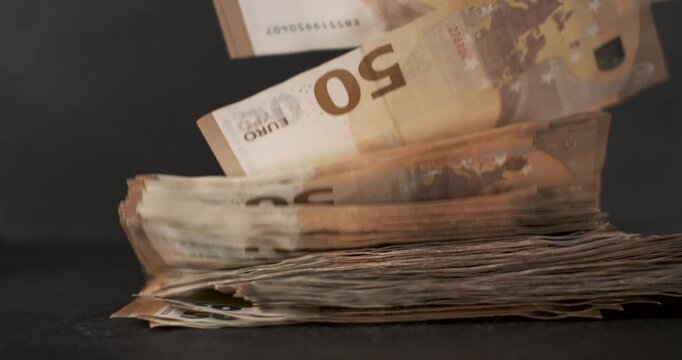 Slow motion money stacking with detailed movement and high speed recording