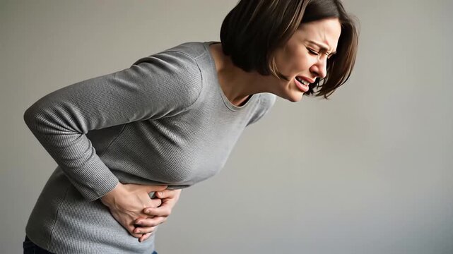 Woman suffering from stomach pain