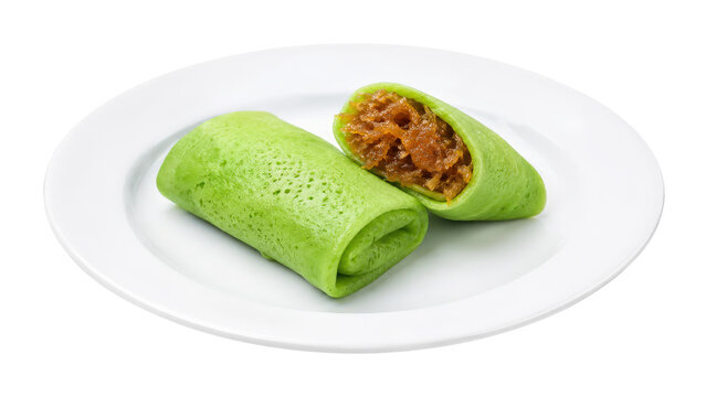Dadar Gulung Indonesian Green Crepes with Coconut Filling on Plate