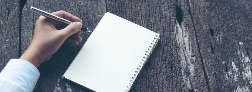 Banner Woman hands pen workspace. Woman hands pen writing notebook. hands pen writing notebook planing meeting excel graph chart. Banner Time management business strategy document with copy space