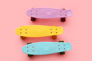 Obraz premium Colorful skateboards on pink background
