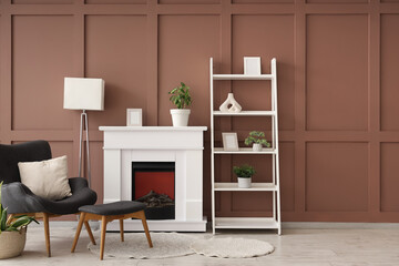 Obraz premium Interior of stylish living room with lamp, fireplace and armchair
