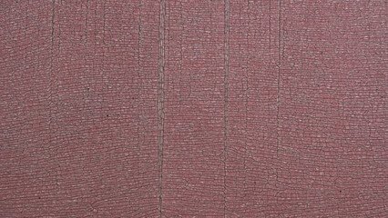 Fototapeta premium Abstract background texture featuring heavily cracked and weathered pinkish plastic or PVC surface, ideal for grunge conceptual designs.