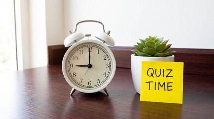 Naklejka premium Alarm Clock Next to Quiz Time Note on Wooden Desk with Small Plant in Soft Light