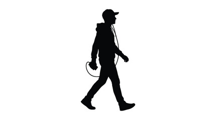 Obraz premium Silhouette of a young man wearing a hoodie and a baseball cap while walking and listening to music using wired headphones on a plain white background