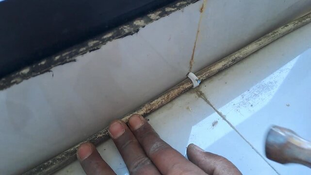 Technician connecting electrical wires for outlet using pliers and hot glue gun. Wiring installation and insulation process. Electrician stock video 4K for DIY, renovation, safety, construction, maint