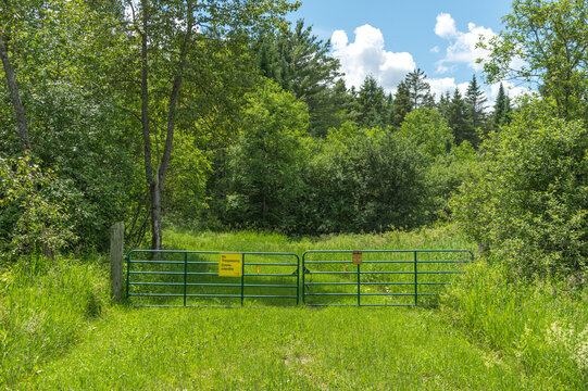 Country Property with Cattle Gate and No Trespassing Signs