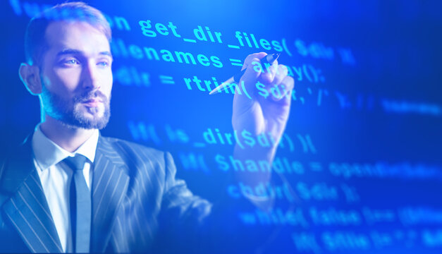 Software developer, businessman writing computer code with digital programming interface and blue technology background