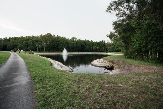  a florida community pond with sunset and colorful cloud