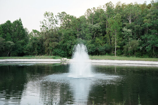  a florida community pond with sunset and colorful cloud