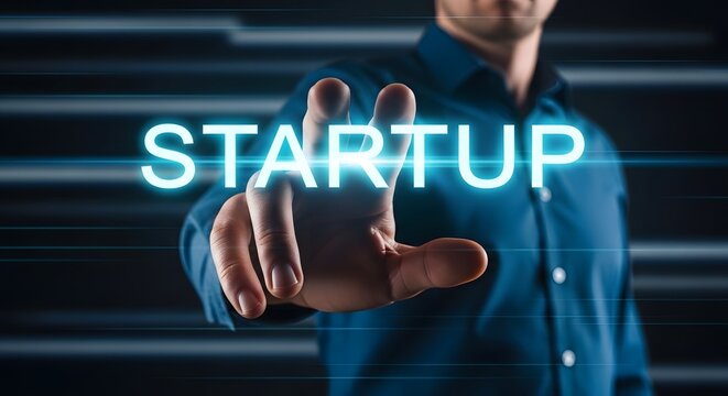Entrepreneur touching startup button for new business venture