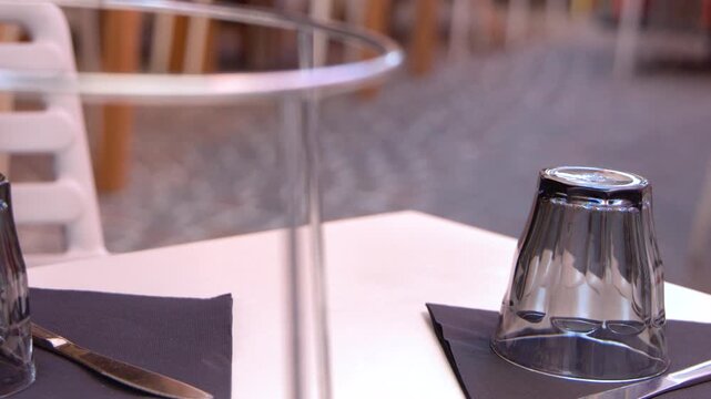 Outdoor Restaurant Table Setting with Glassware and Napkin in Cassis