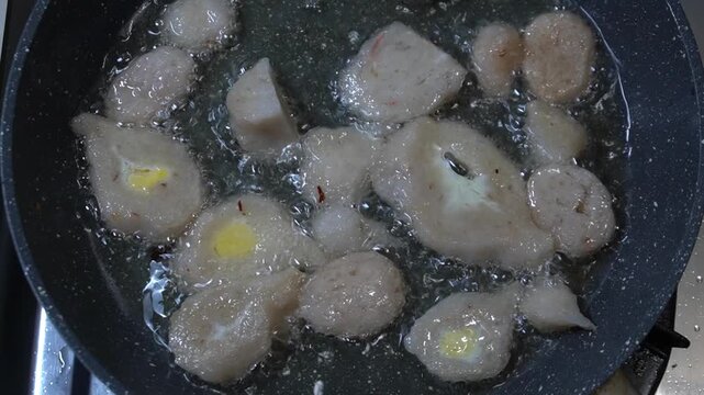 Traditional Palembang Pempek Deep Frying in Hot Cooking Oil