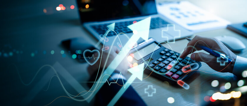 Businessman use calculator to analyze healthcare business graph data,representing medical growth investment,health insurance cost estimation,financial report,medical business,rising growth in hospital