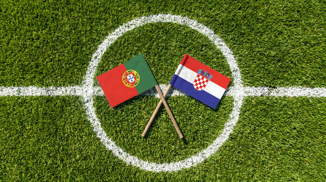 Portugal and Croatia crossed flags flat lay on soccer field center circle