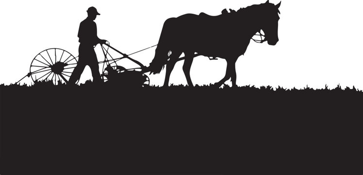 Silhouette of man plowing field with horse