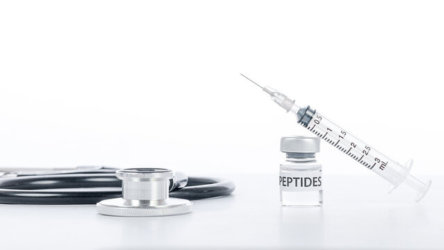 Professional wellness clinic setup with peptide vial syringe and stethoscope offers reassuring sense of hope for healthy medical treatment