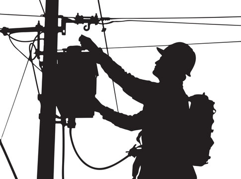Silhouette of a lineman working on a utility pole worker