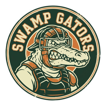 A vintage-style circular emblem featuring a fierce cartoon alligator wearing a baseball catcher's mask and chest protector, with 'SWAMP GATORS' text.