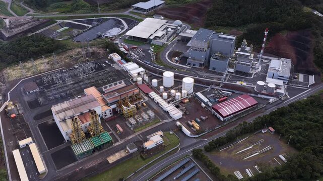 Aerial view of the Tecnovia Acores industrial facility featuring storage tanks, power infrastructure, and factory buildings in Rabo de Peixe, Acores, Portugal.