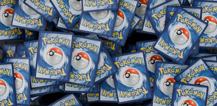 Stacked pile of English Pokemon Trading Cards, with the reverse side showing, TCG version