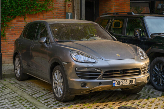 June 24, 2026, Tbilisi, Georgia Gray Porsche Cayenne Second Generation 2010 2014 with Xenon Headlights and Panoramic Roof