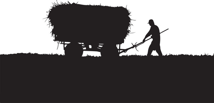 Silhouette of a man pulling a hay wagon with a pitchfork