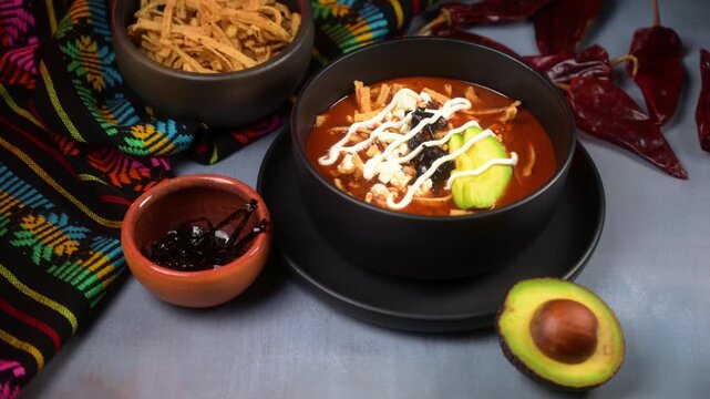 Authentic Aztec soup or sopa Azteca served with crispy tortilla strips, fresh cheese and cream. Mexican food