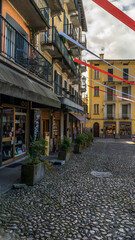 Naklejka premium Bellagio City Old Town Street and Basilica di San Giacomo Church, Italy