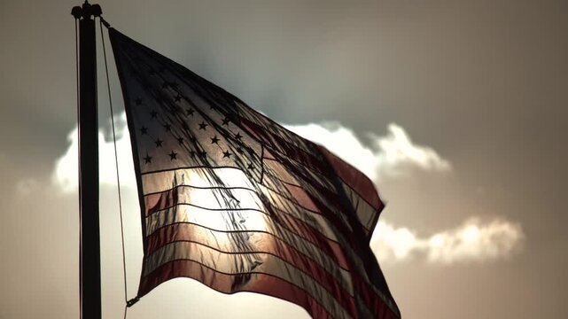 American Flag Waving with Pride Backlit by Golden Sunset Beams