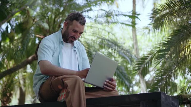 Digital nomad entrepreneur working online on laptop computer