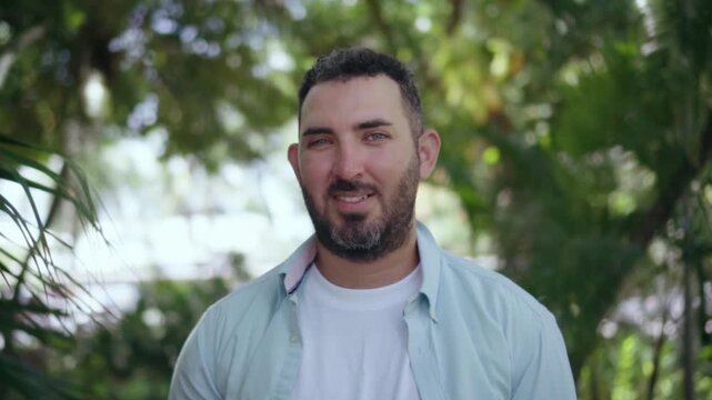 Portrait of smiling bearded man standing outdoors