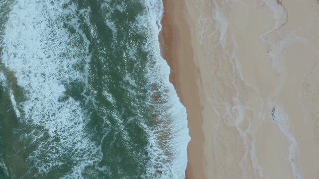 Drone flying upward shot of hte atlantic Ocean in Playa Garzon