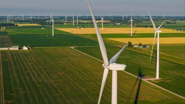 Wind turbines generating clean energy in vast rural landscape in Michigan