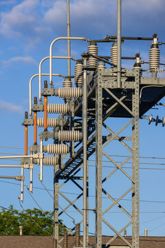Electrical substation structure distributing power on a sunny day