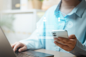 User accessing a secure account on smartphone and laptop with multi-factor authentication and...