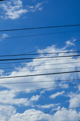 Fototapeta premium Power Lines Against Blue Sky