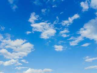Fototapeta premium Blue Sky with Scattered White Clouds