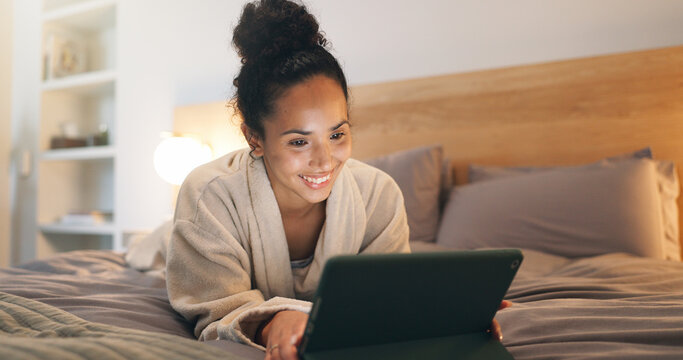 Chilling, home and happy woman with tablet on bed, reading or ebook subscription in bedroom at night. Evening, reader and person with tech for story, internet connection and novel download in house