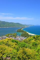 Fototapeta premium Amanohashidate, a 3.6 kilometer sandbar, known for its beaches and thousands of pine trees in Monju, Miyazu, Kyoto, Japan
