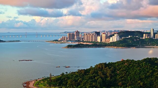 Aerial view of coastal cityscape with bridge and modern buildings in Zhuhai, China 