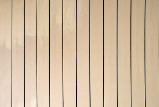 Light brown wooden planks texture background in vertical pattern