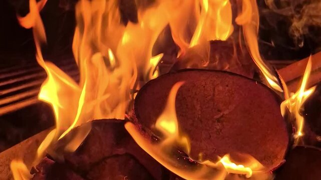 close-up of coconut shells being burned for a campfire
