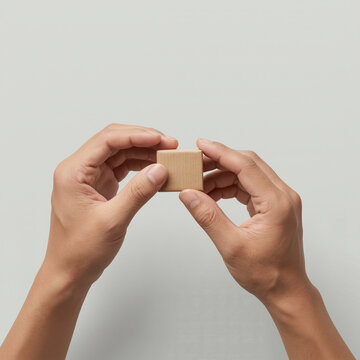 Hands holding small cardboard box for logistics delivery concept