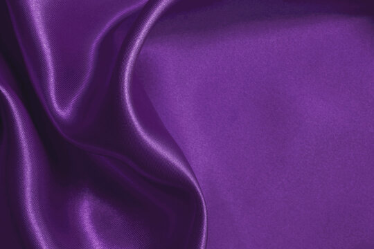 Purple fabric cloth texture for background and design art work, beautiful crumpled pattern of silk or linen.
