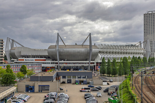 Eindhoven, Netherlands, June 13, 2026. External view of the iconic Philips Stadion, home of PSV Eindhoven, featuring the parking lot and adjacent railway tracks.